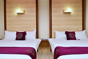 Postel nebo postele na pokoji v ubytování Hotel Yong Cheng