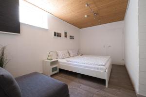 Ένα ή περισσότερα κρεβάτια σε δωμάτιο στο Ina's Ferienwohnung