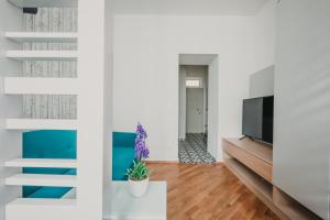 Telewizja i/lub zestaw kina domowego w obiekcie ZEUS Design Apartments Wasserwelt