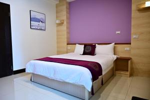 Krevet ili kreveti u jedinici u objektu Hotel Yong Cheng