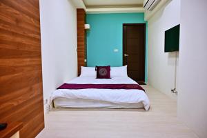 Krevet ili kreveti u jedinici u objektu Hotel Yong Cheng