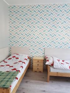 グダニスクにあるAnmar Kościuszkiのベッドルーム1室(ベッド2台付)が備わります。