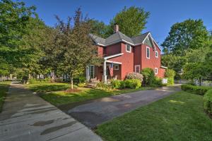 a red brick house with a driveway at Northwest Michigan Duplex half Mi to Lake Michigan in Charlevoix