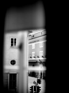 a view of a building through a window at artHotel Blaue Gans in Salzburg