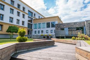 a wooden walkway in front of a building at Dom Studenta AŁ in Łomża