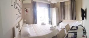 A television and/or entertainment centre at Athena Charming Rooms