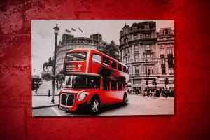 a red double decker bus on a city street at Spa Secret in Belgrade