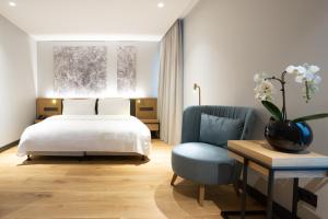 Postel nebo postele na pokoji v ubytování Vilnius Grand Resort