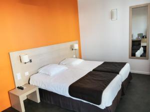 Postel nebo postele na pokoji v ubytování Esatitude Hotel