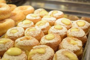 a bunch of donuts with powdered sugar on them at Hotel Everest in Bellaria-Igea Marina