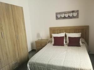 Posteľ alebo postele v izbe v ubytovaní Residencial Islas