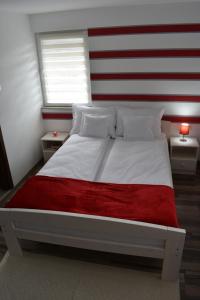 Postel nebo postele na pokoji v ubytování Casa DODÓ Vendégház