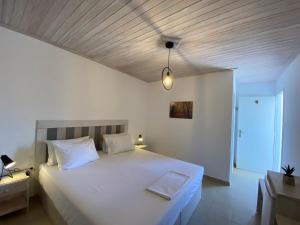 Postel nebo postele na pokoji v ubytování Leonidas Resort