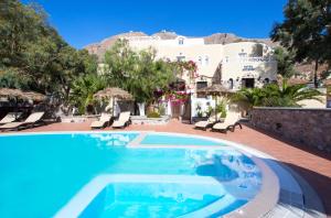 a villa with a swimming pool and a resort at TheArtemis Perissa in Perissa