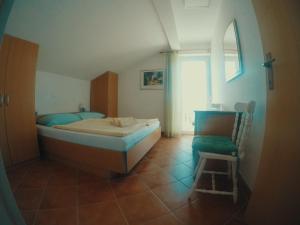 Кровать или кровати в номере Apartements Magdalena