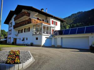 a house with a lot of solar panels on it at Ferienhaus Lerch in Sankt Gallenkirch