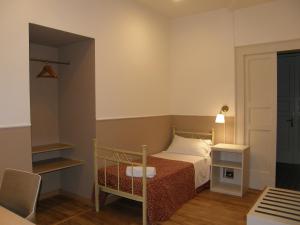A bed or beds in a room at Il Gattopardo House