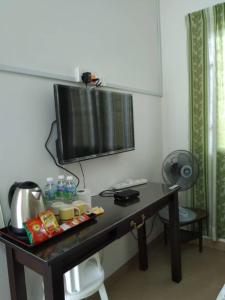 TV a/nebo společenská místnost v ubytování Ng Family’s Farm Stay