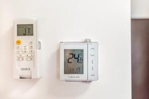 an electronic device is attached to a wall at Pensiunea Armonia in Nădăşelu