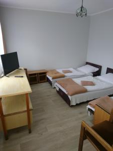 Posteľ alebo postele v izbe v ubytovaní OW Gromada Pod Topolami