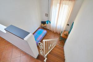 a small room with a bunk bed and a staircase at Hotel Garibaldi in Finale Ligure