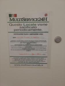 a sign on a wall that readsmusbestosoxide iodine vitamin semiconductor performance at Affittacamere San Martino in Genoa