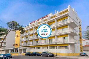 a hotel with a sign that reads clean and safe at Hotel Alvorada in Estoril