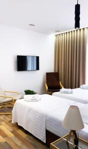 TV a/nebo společenská místnost v ubytování Asi Rooftop Hotel
