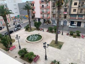 an aerial view of a fountain in the middle of a city at Marconi’ home in Margherita di Savoia