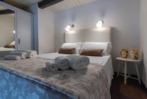 מיטה או מיטות בחדר ב-Made in Ortigia Apartments