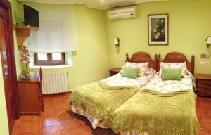Postel nebo postele na pokoji v ubytování Hostal Mizmaya