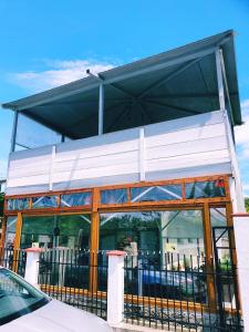 a building with a fence in front of it at Casa Razvan Vama Veche in Vama Veche