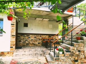 a building with a staircase and a brick wall at Casa Razvan Vama Veche in Vama Veche