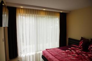 Postel nebo postele na pokoji v ubytování Zafo Hotel