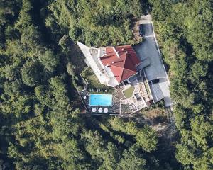 an aerial view of a house with a roof at Forest Suites Boutique Hotel in Megalo Chorio