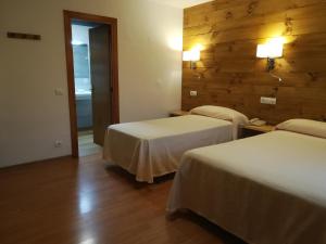 Postel nebo postele na pokoji v ubytování Hotel Vicente