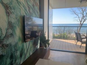 a living room with a view of the ocean at Seaside Park apartamenty prywatne z widokiem na morze in Kołobrzeg