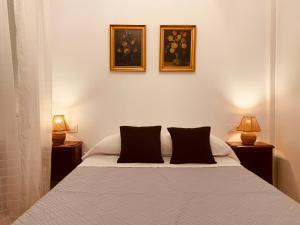 Postel nebo postele na pokoji v ubytování Hostal Patria Madrid