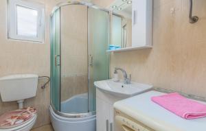 a bathroom with a shower and a sink and a toilet at Apartments Mioković in Soline +43 photos