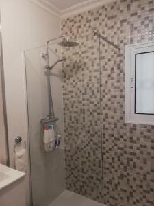 a shower stall with a glass door in a bathroom at Calle Dr Fleming 3 bedroom home for 6 people in San Javier +36 photos