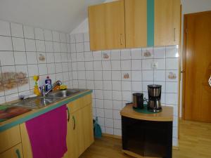 a kitchen with a sink and a counter top at PP. Pension Petra in Neuenkirchen-Vörden