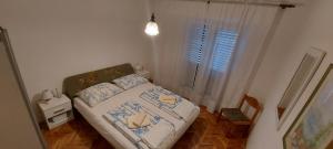 Postel nebo postele na pokoji v ubytování Apartment Grubišić