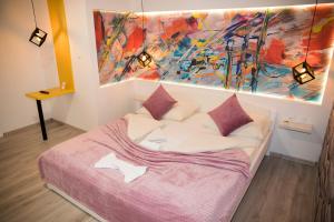 Postel nebo postele na pokoji v ubytování Hotel Villa Nadin