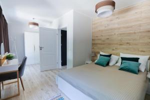 Postel nebo postele na pokoji v ubytování ANKA Apartamenty nad Morzem