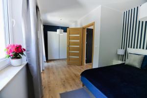 Postel nebo postele na pokoji v ubytování ANKA Apartamenty nad Morzem