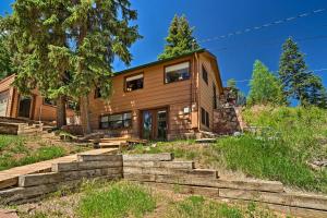 a house with stairs leading up to it at Cozy CO Rocky Mountain Retreat Near Pikes Peak! in Green Mountain Falls