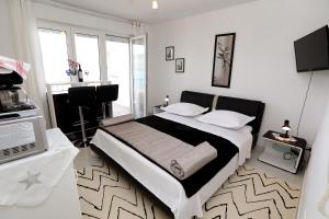 Posteľ alebo postele v izbe v ubytovaní Apartments ITD