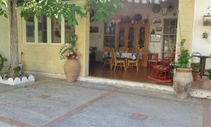 a house with two vases on the front of it at L'ANTICA TORRE in Marsala