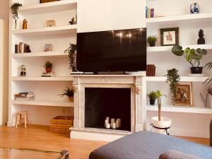 TV a/nebo společenská místnost v ubytování Hostal Patria Madrid