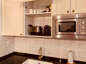 Kuchyň nebo kuchyňský kout v ubytování Hostal Patria Madrid